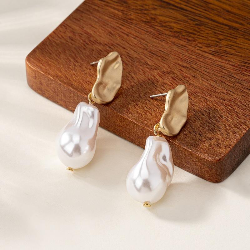 Meier Pearl earrings: minimalist, commute-ready style. elegant earrings for women, perfect for year-round wear