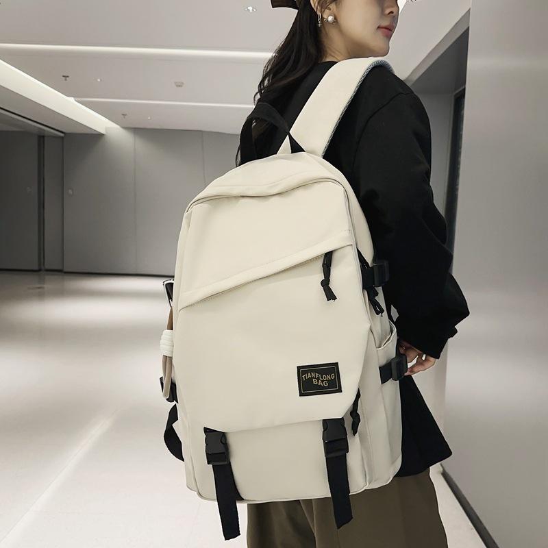 Schoolbag wholesale backpack trend simple outdoor couple backpack male large capacity junior high school high school college student schoolbag