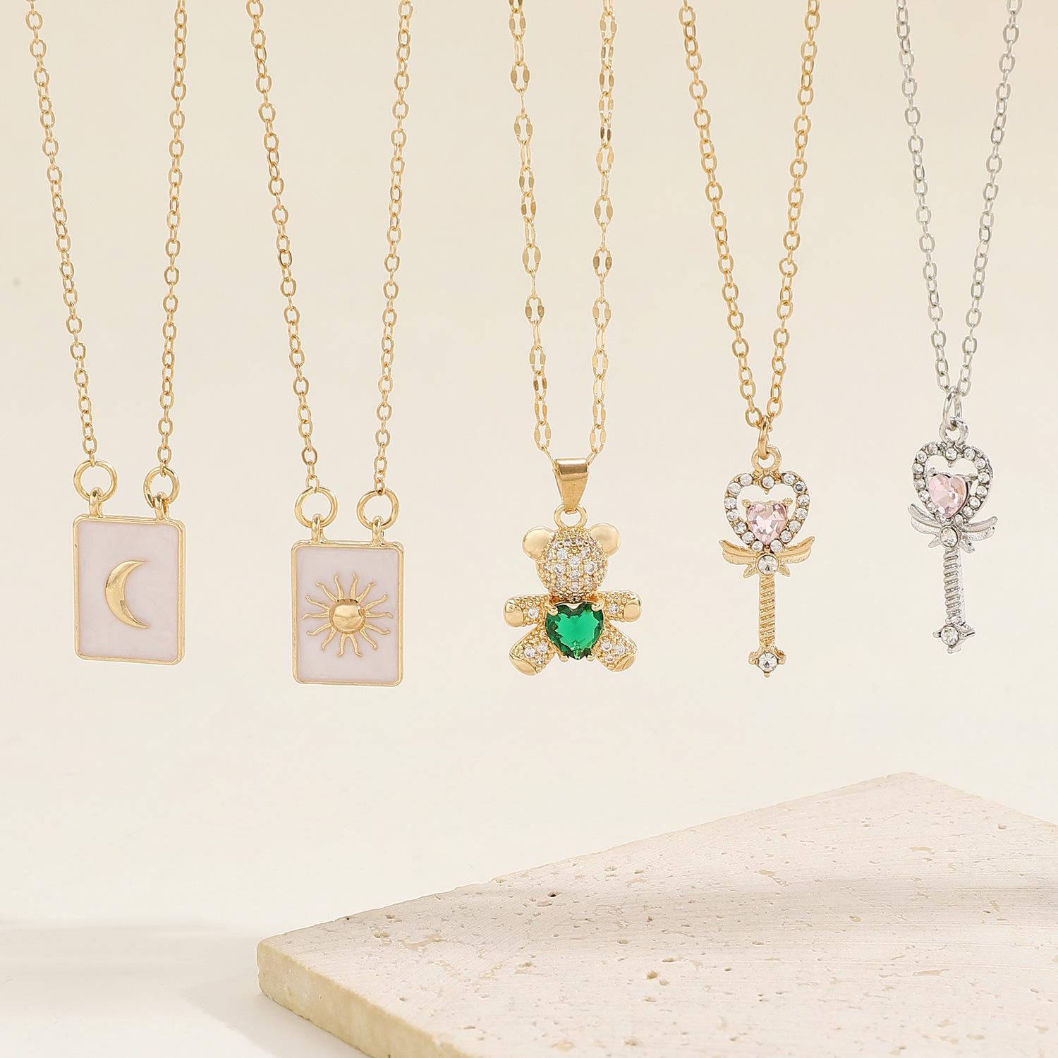 

Sun and Moon Symbol Square Pendant Necklace - Heart, Magic Wand, and Bear Design