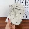 Korean black and white polka dot bow baseball cap female versatile sweet cute niche design show face small cap