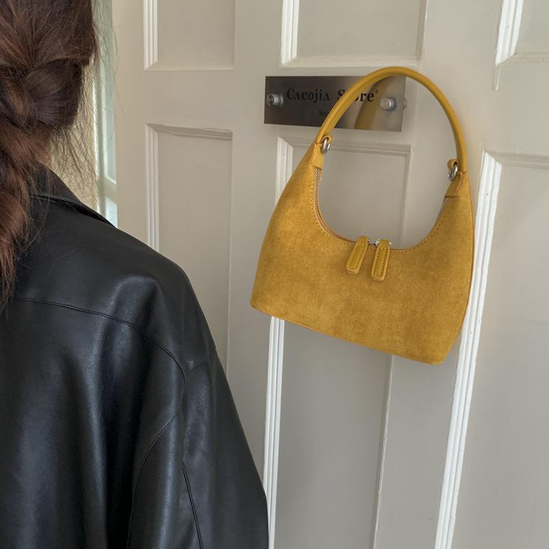 Retro fashion dumpling bag women 2025 new bag high sense light luxury niche commuting single shoulder cross hand bag