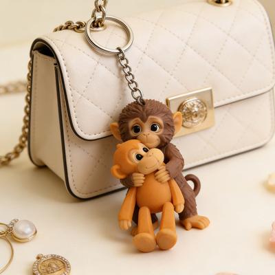 Affen-Schlüsselanhänger Niedlicher Affe hält Schlüsselanhänger Dekoration Plüschtier für Rucksack Handtasche Tasche Zubehör