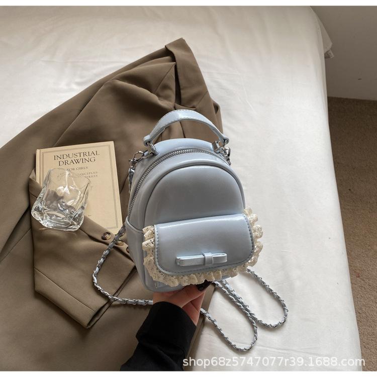 Korean fashion hand-held crossbody bag women's 2025 summer new simple bow backpack casual school bag