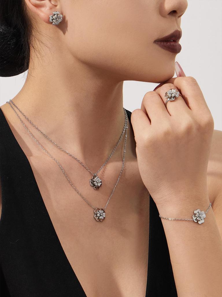 European & American Light Luxury Clover Jewelry Set: Stainless Steel, Zirconia-Embedded, Versatile Necklace, Bracelet, Ring & Earrings for Women.