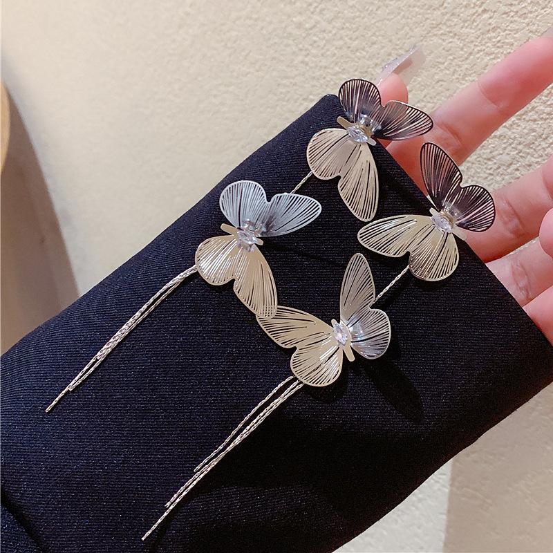 

European and American exaggerated metal butterfly fringed earrings, women s personality design, unique high-end earrings, fashion temperament earrings 925 silver needle
