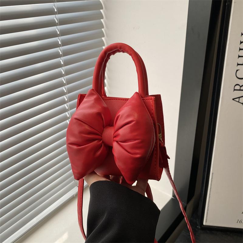 Niche bow solid color new mini hand carry small square bag summer beautiful retro shoulder messenger bag women