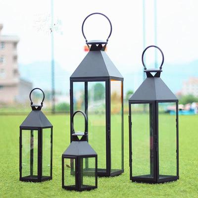 European-Style Wrought Iron Windproof Lanterns - Floor-Standing & Handheld Candlestick Ornaments for Weddings and Courtyard Decoration.