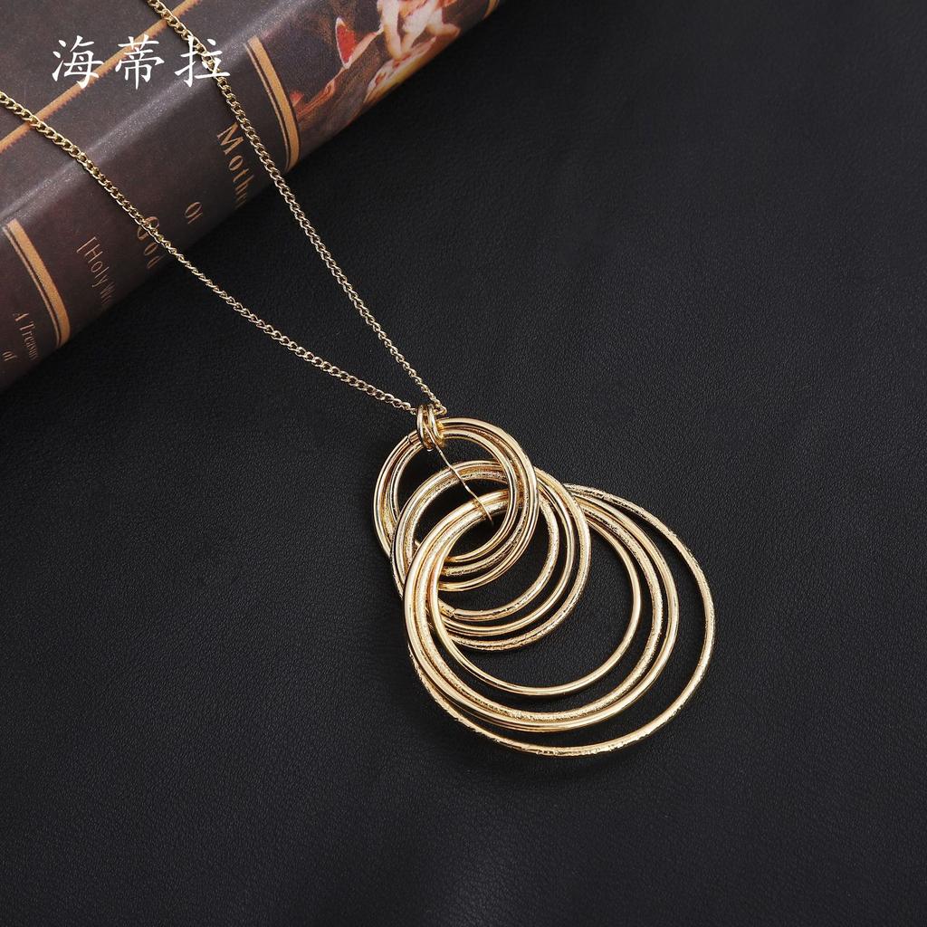 New Geometric Ring Stacked Long Sweater Chain, Fashionable and High-end Women's Versatile Ring Long Pendant