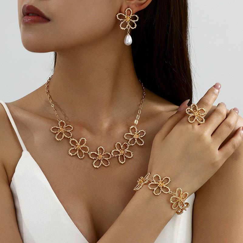 Retro Metal Hollow Flower Jewelry Set: Necklace, Bracelet, Earrings & Ring for Elegant Women