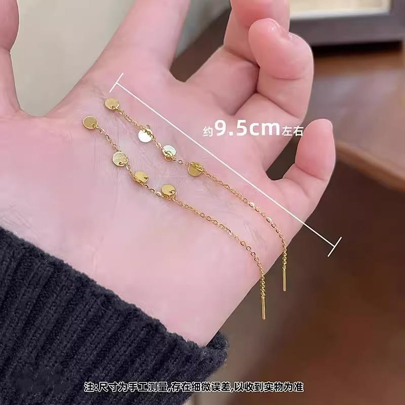 

True Gold Small Round Pieces with Long Fringes As Earrings, Featuring A Unique and Individualistic Style.
