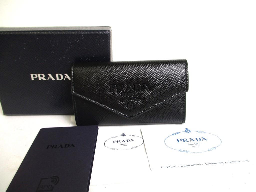

Автентичний брелок PRADA із блискучою чорною шкірою Saffiano 4 фото №a276 відремонтований
