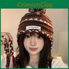 Cozy Knitted Chic Winter Hat For Women Featuring Colorful Pom Poms Warmth And