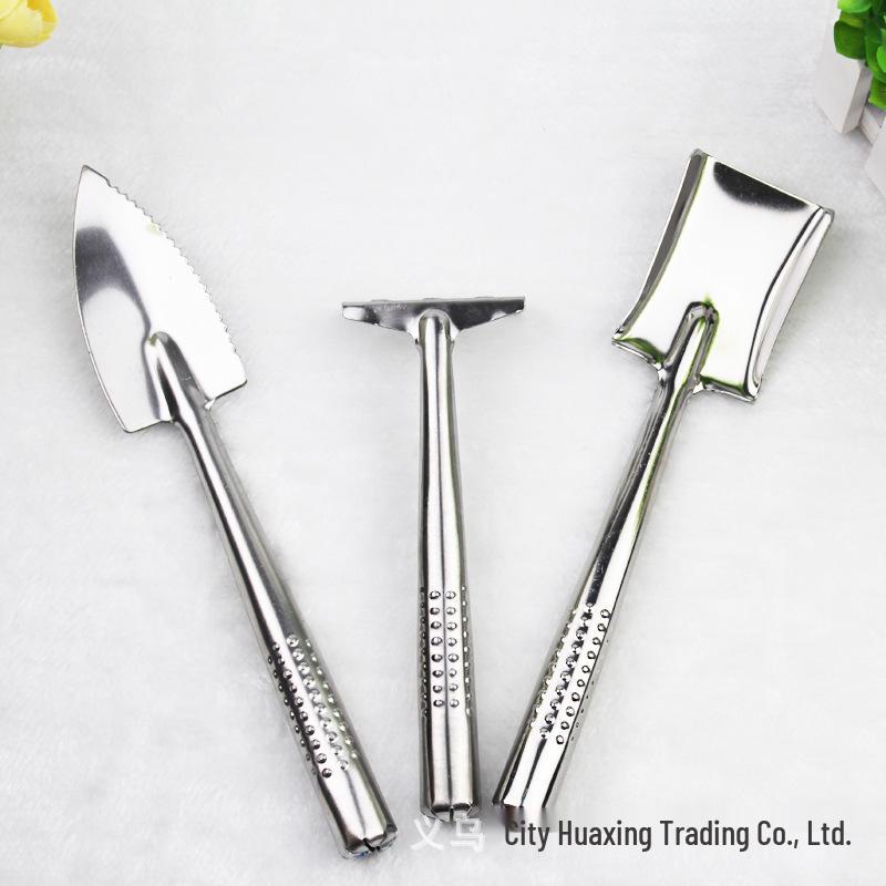 Gartenwerkzeug-Set aus Edelstahl: Schaufel, Hacke und Rechen für Blumen und Topfpflanzen.