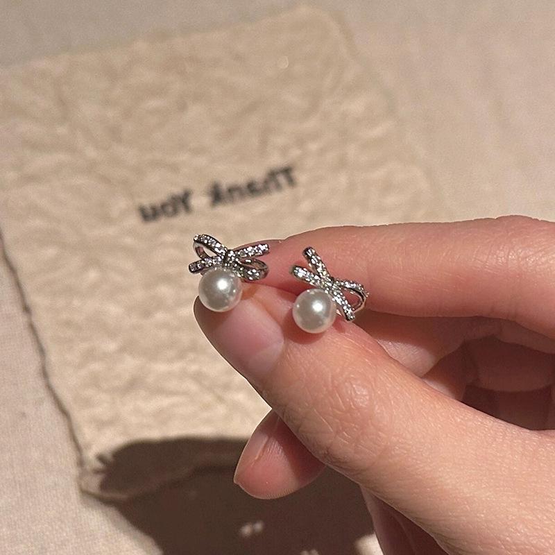 Elegant Zircon Pearl Bow Stud Earrings for Women: Luxurious, Unique, Minimalist, and Versatile.