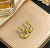 Stainless steel high-end gold earrings, niche design light luxury metal studs, temperament earrings