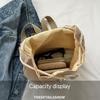 Schicker leichter Canvas-Rucksack mit Quasten-Detail Modischer Kordelzugverschluss Polyestergefüttert Damen Reise-Tagesrucksack