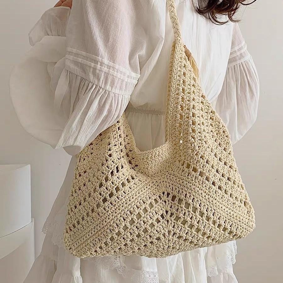 

New large-capacity leisure triangle hollow woven bag pastoral art shoulder bag vacation versatile women s bag wholesale