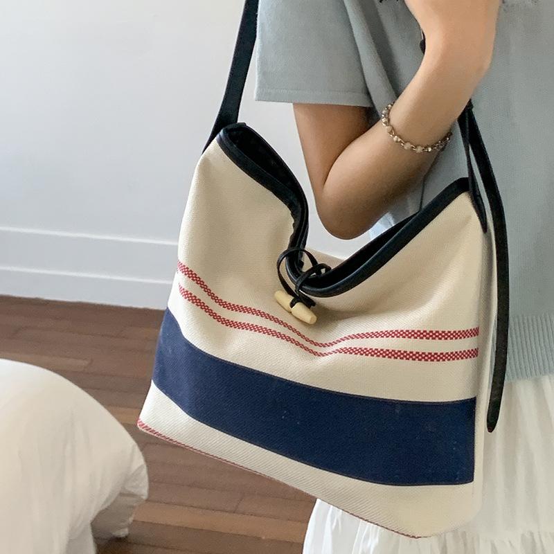 Niche High-value Handbag Small Bag Women's 2025 New Striped Canvas Bag Fashionable Shoulder Crossbody Bucket Bag