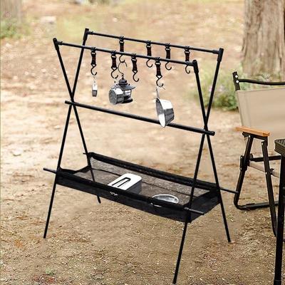 Portable Double-Layer Foldable Storage Rack with Mesh Bag for Outdoor Camping, Self-Driving Tours, Home Use, and Picnics.