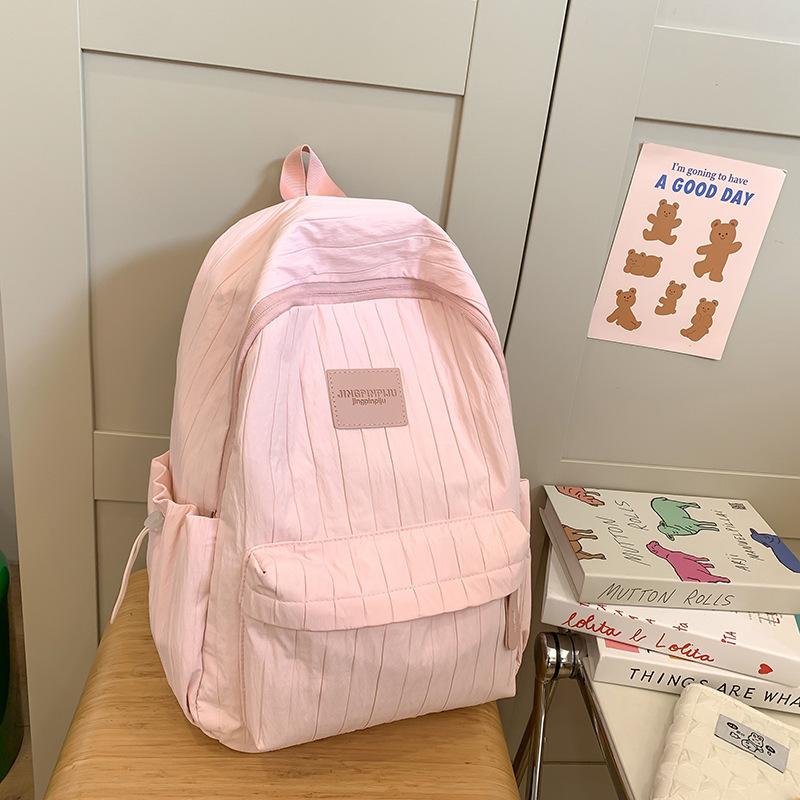 Fashion travel lightweight middle school college students class solid color backpack 2025 new simple niche design school bag