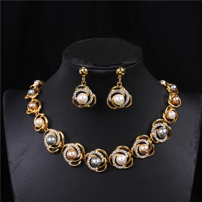 Elegant Pearl and Crystal Jewelry Set: Necklace, Earrings, & Bracelet for Brides