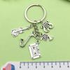 Antique Silver Music Cassette & Saxophone Keychain with Creative Design