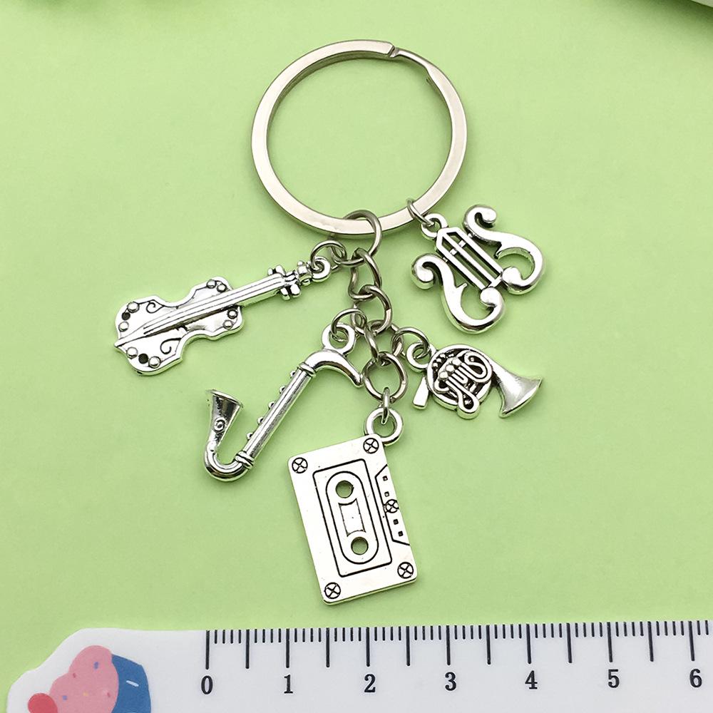 Antique Silver Music Cassette & Saxophone Keychain with Creative Design