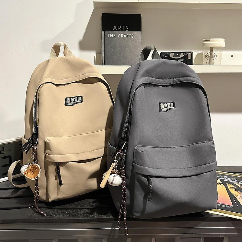 Student schoolbag Junior high school student backpack Elementary school student school large capacity high value solid color schoolbag new
