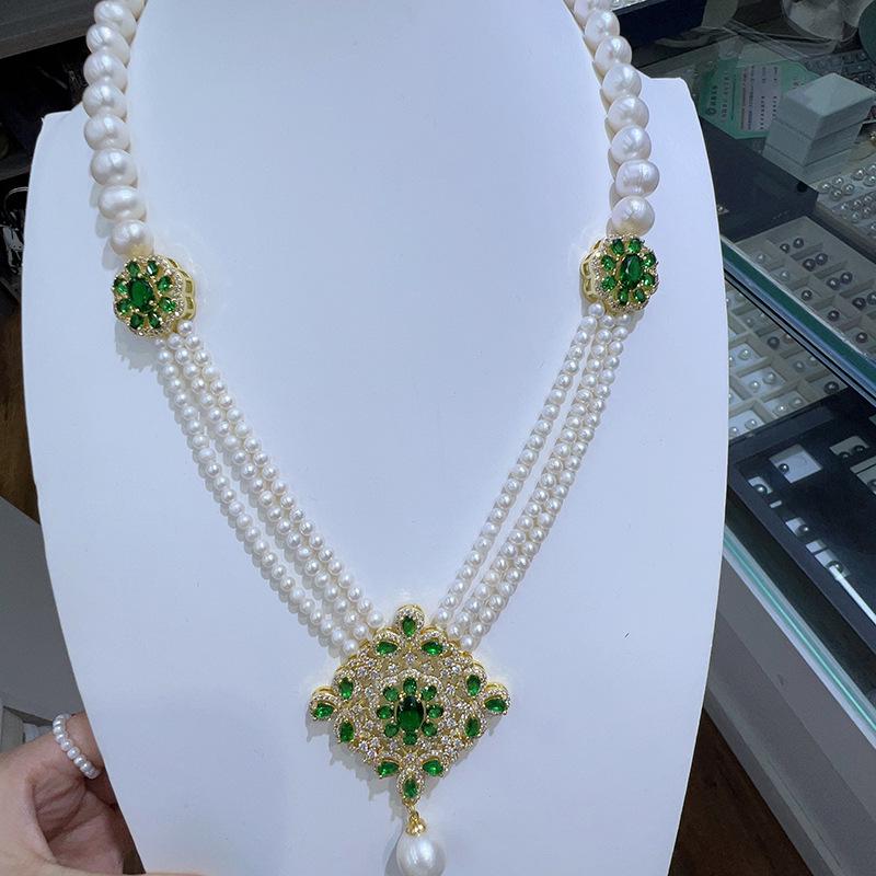 Elegant Multi-Layer Pearl Necklace with Emerald Accents