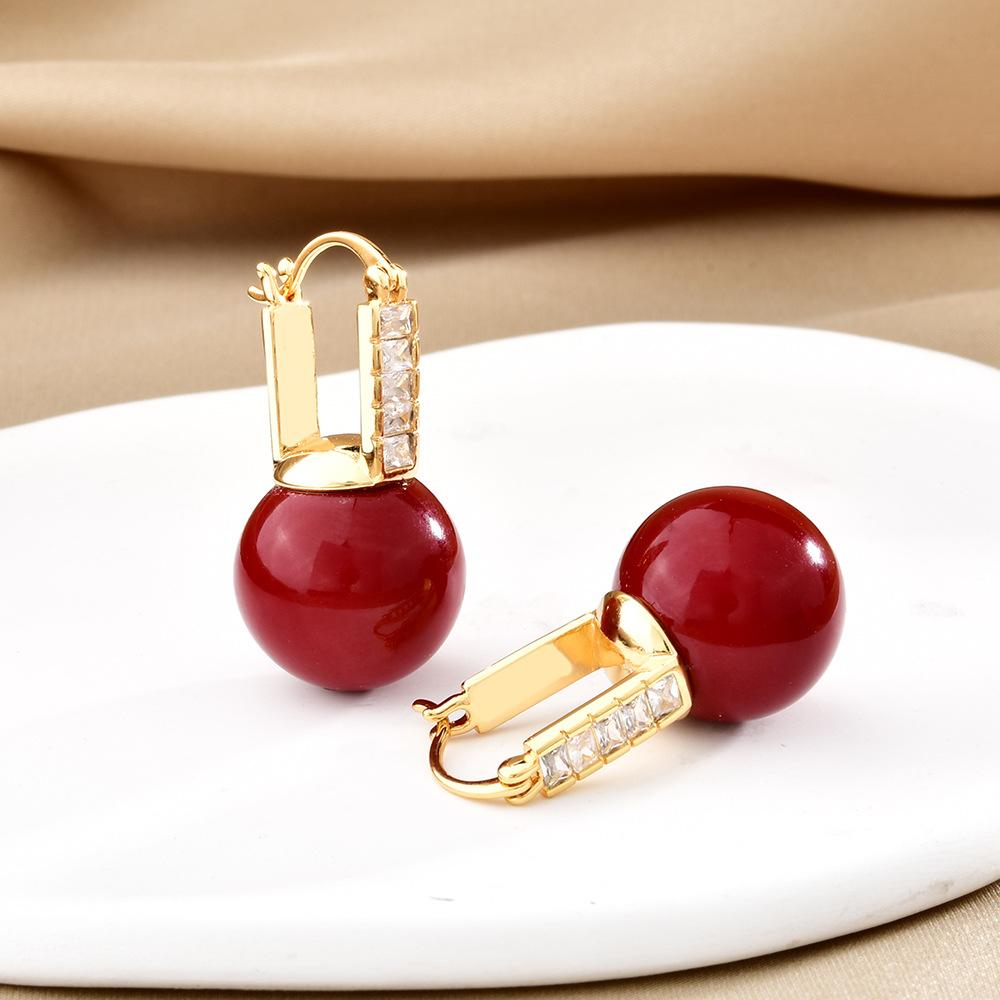 Autumn and winter new red retro pearl earrings fashion festive temperament versatile stud earrings Ankola red fireworks earrings