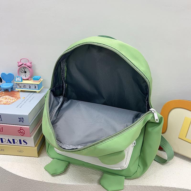 The new Japanese cute little frog backpack is the same for men and women, and the autumn versatile student large-capacity backpack bag.
