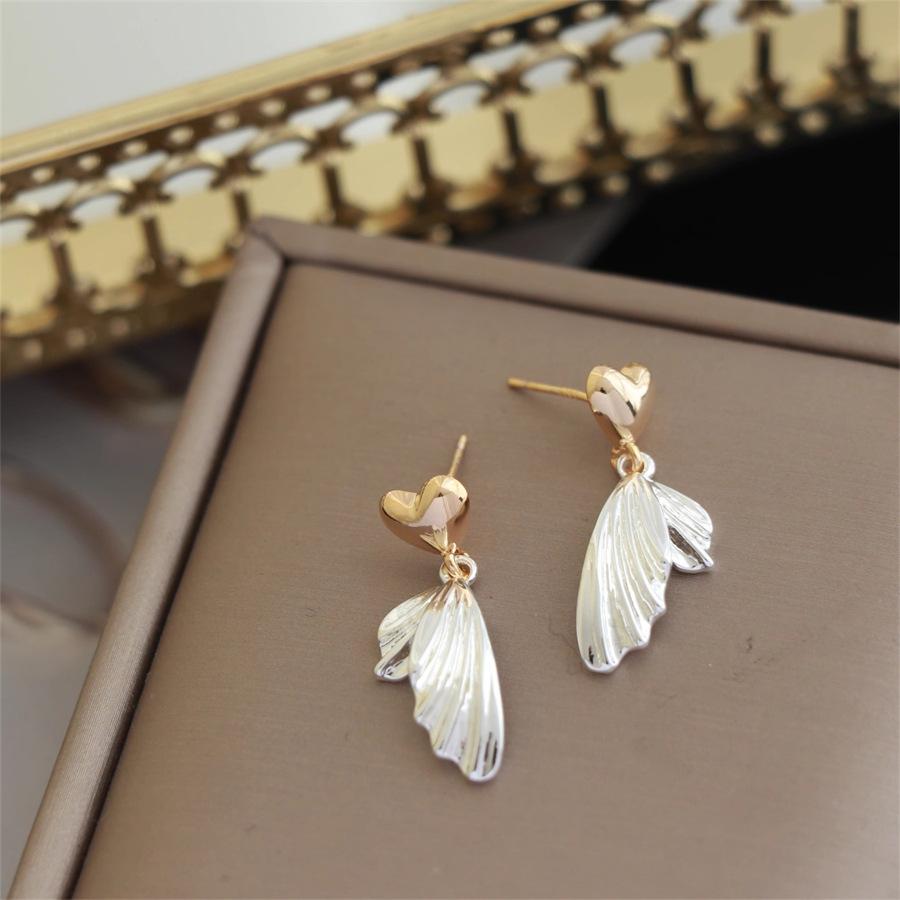 Gold and silver contrasting color love fish tail stud earrings s925 silver niche light luxury earrings temperament versatile earrings