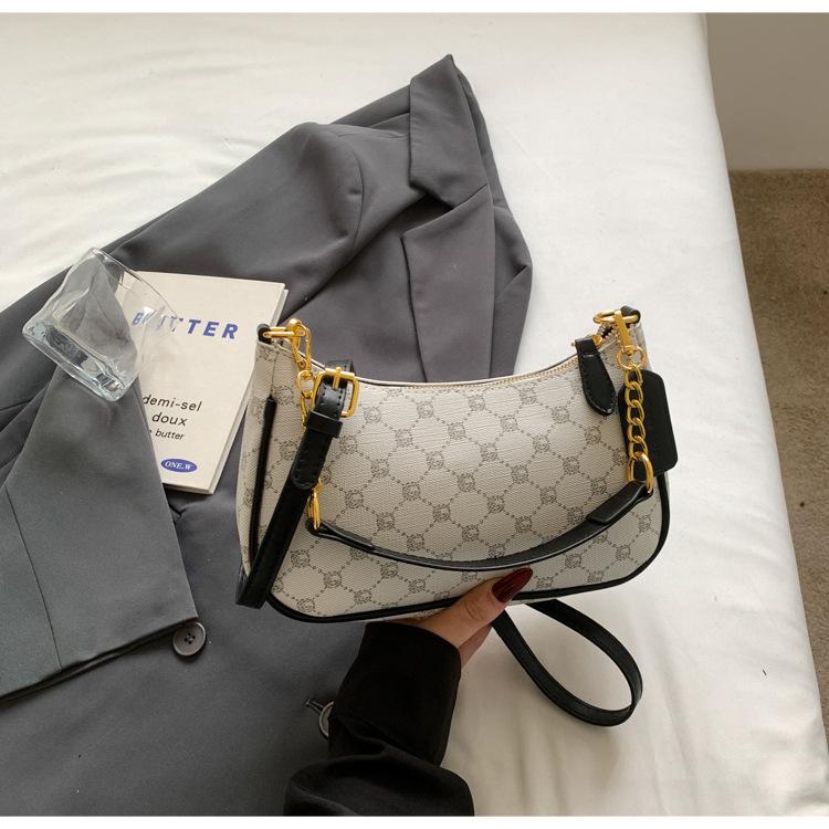 Beliebte einzelne Schulter Achseltasche Sommer neu einfach bedruckt Retro Baguette Tasche lässige Halbmondtasche Tide