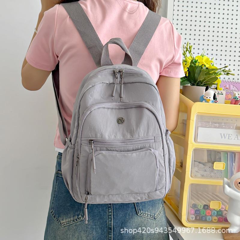 Schoolbag spot wholesale simple fashion backpack high sense niche women outdoor travel commuter small bag