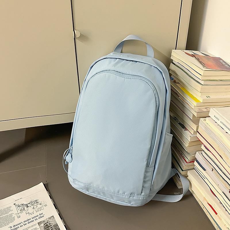 Solid color high-end backpack junior high school students casual simple travel large-capacity backpack