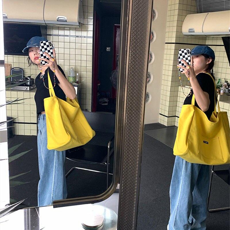 

Сумки через плечо Новая корейская холщовая сумка Большой вместимости Конфетного цвета Студенческая нишевая Одноплечевая Ручная жёлтый