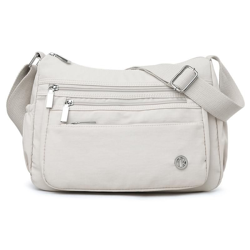 

Женская сумка Легкая сумка через плечо Нейлоновая сумка Большая вместимость Сумка кросс-боди бежевый