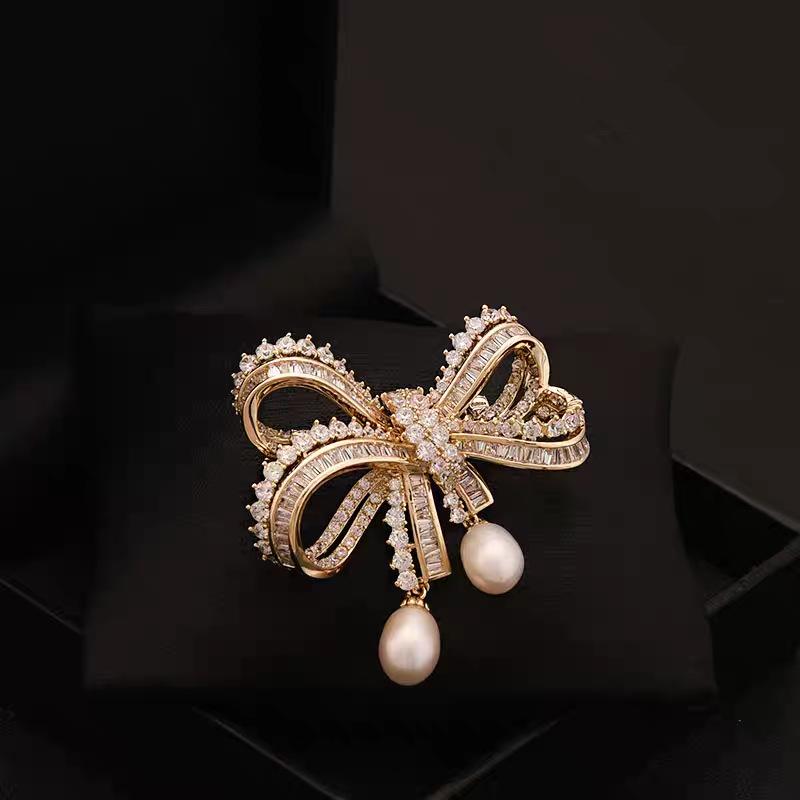 European and American light luxury bow bead pendant brooch new fashion accessories women's suit coat exquisite temperament pin