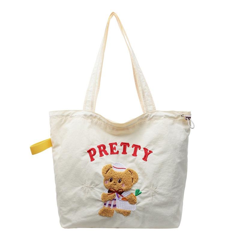 The new School of Arts and Art style is simple and large-capacity tote bag, and women's tide is popular. Versatile commuter shoulder bag.