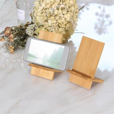 Soporte de madera de bambú para teléfono móvil con orificio de carga Soporte de madera de bambú para teléfono móvil con orificio de carga