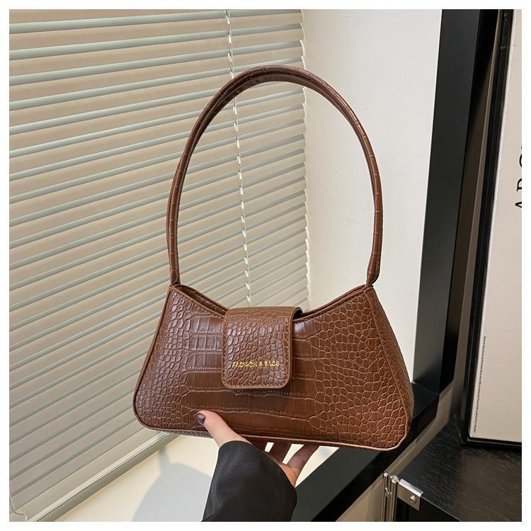 Trendlinie Nischen-Baguette-Tasche modische und einfache Schulter-Achseltasche Damen 2025 Frühling neue Umhängetasche Damentasche