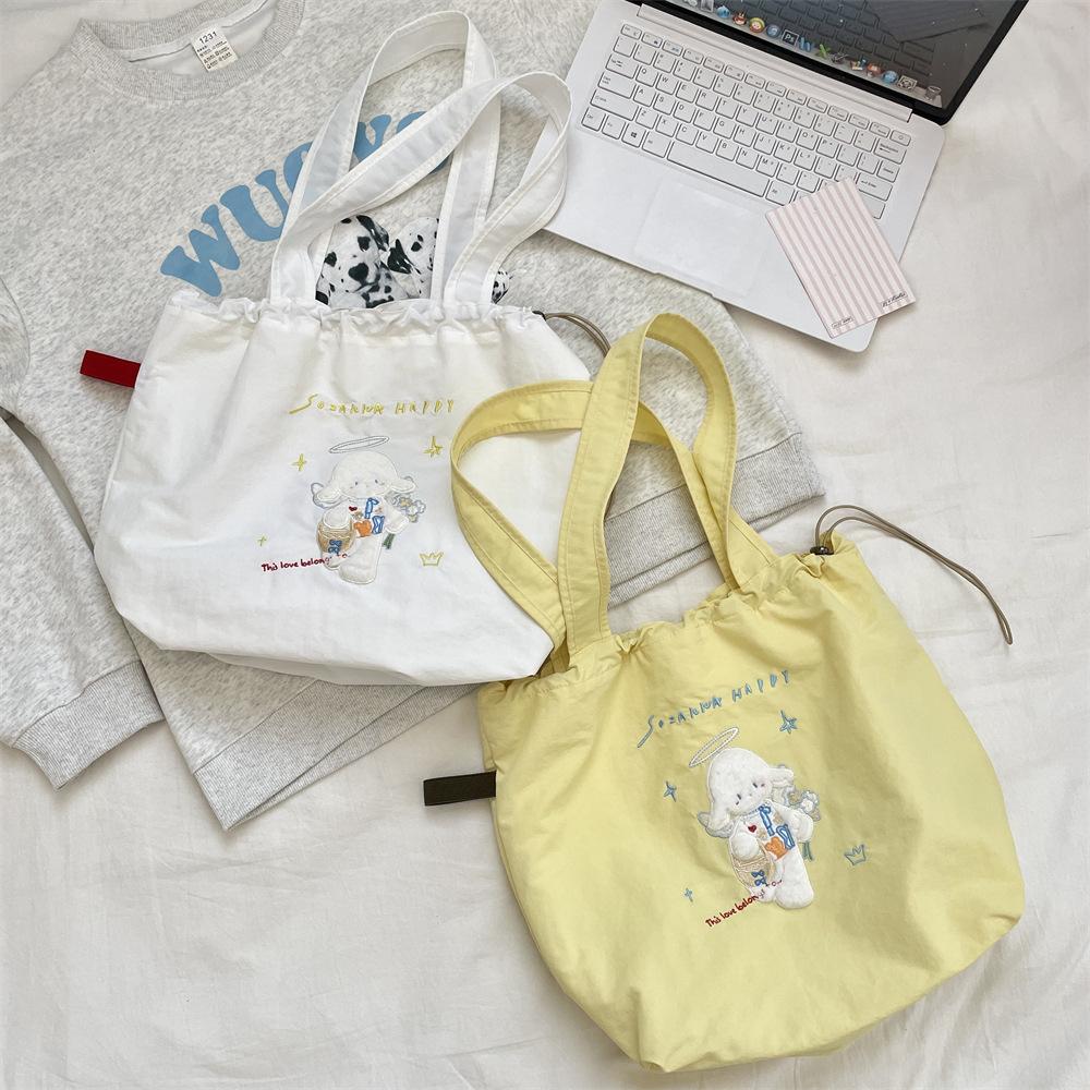 Canvas bag Large capacity women's embroidery lamb fabric bag Simple versatile drawstring bundle shoulder bag