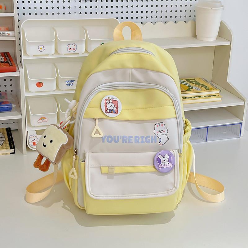 Spacious And Stylish Polyester Backpack With Multiple Color Options And Badge Accessories