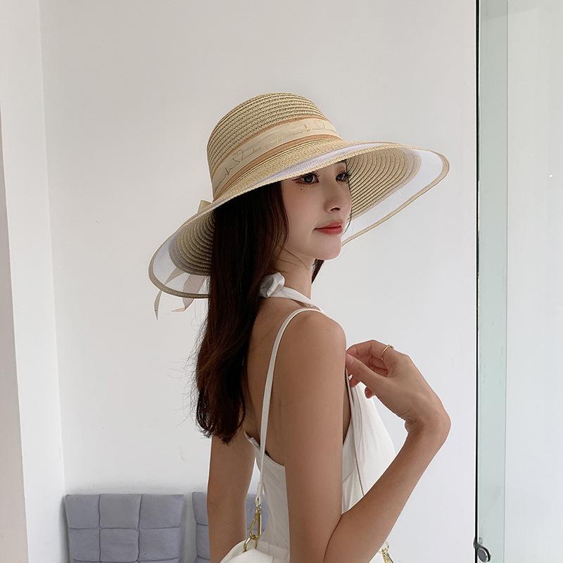 Wide Brim Bucket Hat with Elegant Black Bow - Breathable, Inelastic, and UPF Protective - Perfect for Beach, Travel, and Holiday Outings