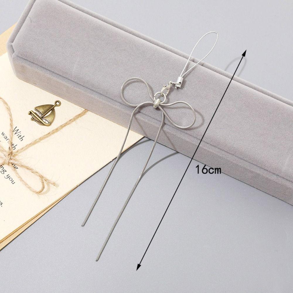 

Metal Bow Mobile Phone Pendnt Snake Bone Mobile Phone Chain Simple Phone Rope Girls New Year Gift style 1