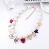 Simple and fashionable Baroque imitation pearl drip oil alloy love insect flower pendant women's collarbone chain