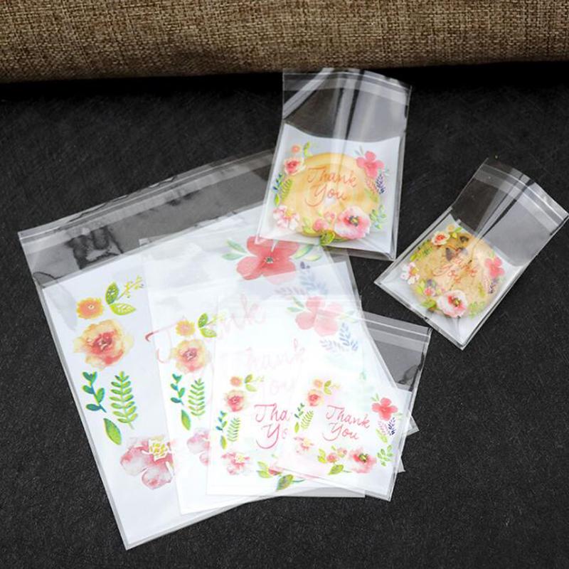 100 bolsas de plástico autoadhesivas con forma de flores para envasar bocadillos, galletas y bizcochos.