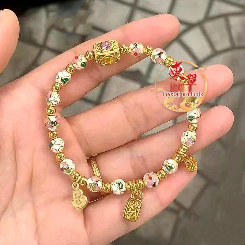 White Cloisonné Luck-Turning Gourd Ji Fu Pendant Bracelet with Flourishing Flowers, Ash Glaze, and Gold Foil Filigree.