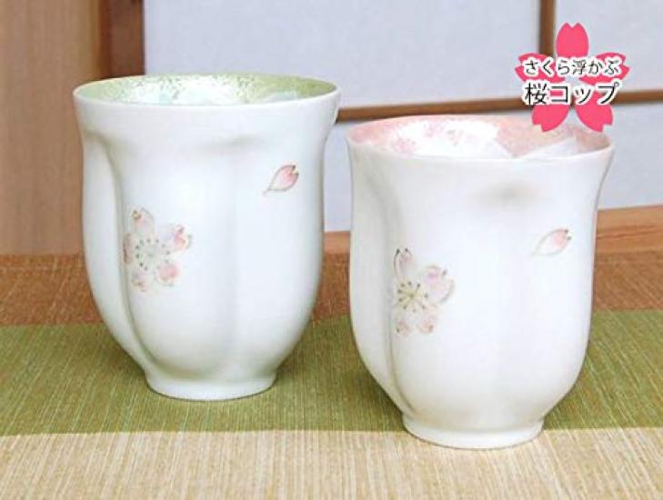 A perfect retirement gift for A pair of teacups with a floating cherry blossom Made in these Arita ware teacups make a perfect couples. design. Japan,