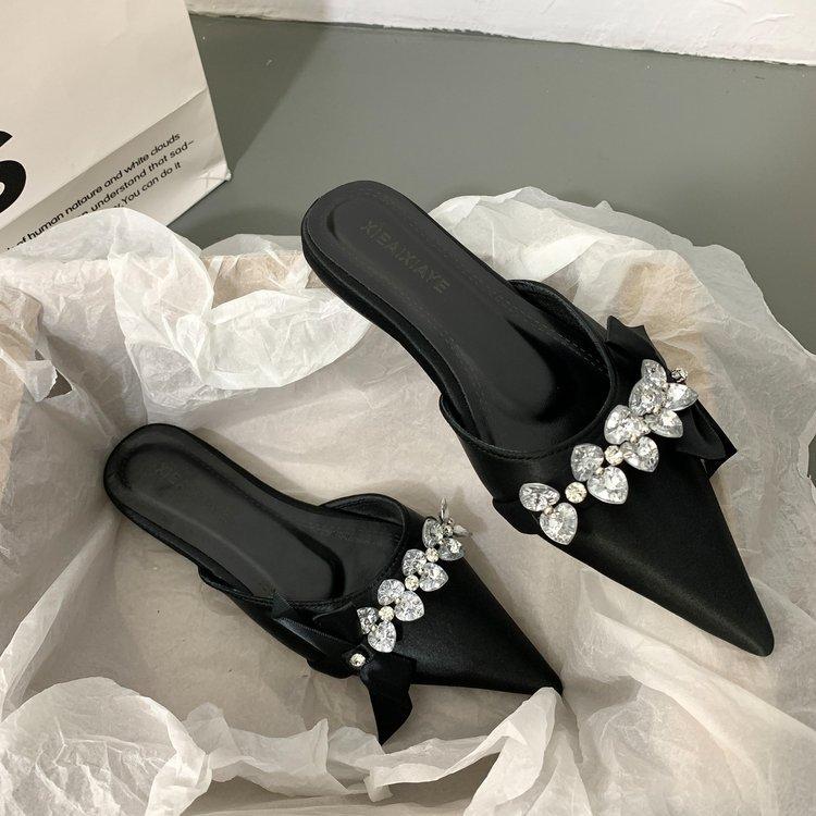 Baotou half slippers women's rhinestone bow wear 2025 new fairy wind pointed head shallow mouth flat-soled muller shoes